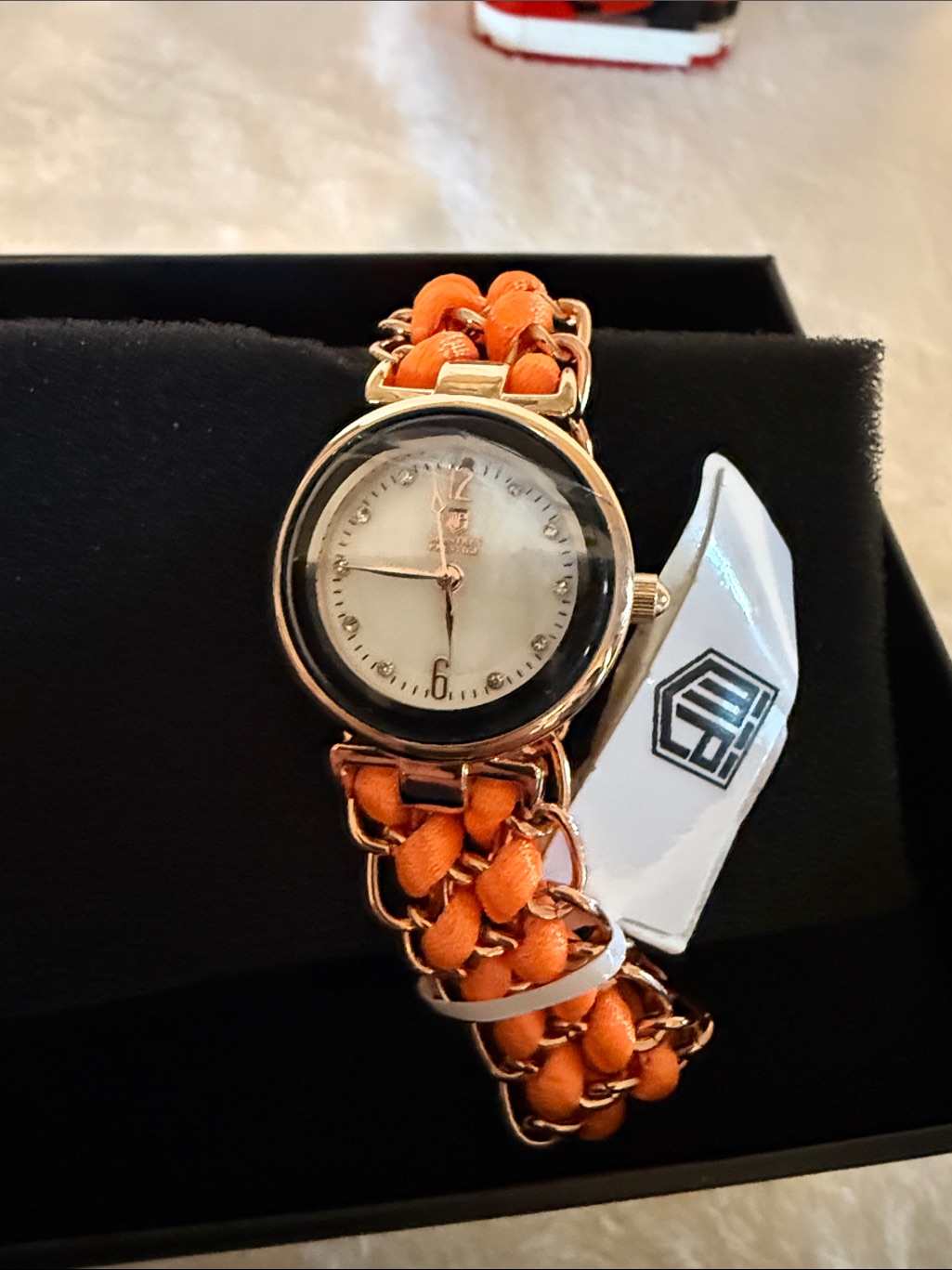 GoldTone Womens Watch With Orange Woven Chain Woven Band
